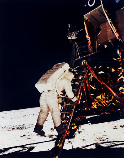 NASA photo of Buzz Aldrin stepping off of the LM ladder