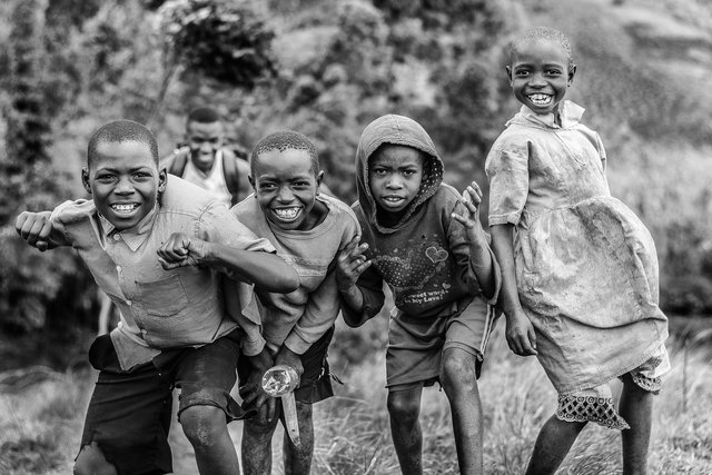 boys climbing hill
