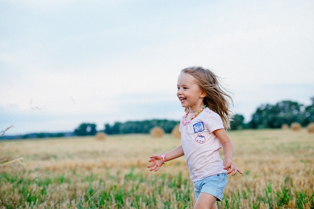 child in field
