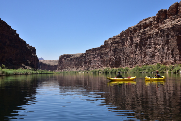 Kayak and pack raft entering the canyon